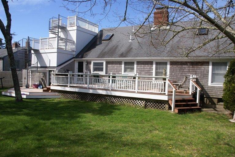 39 Pine Grove Road Chatham, MA 02633 - Photo 32 of 34 a view of a house with a backyard