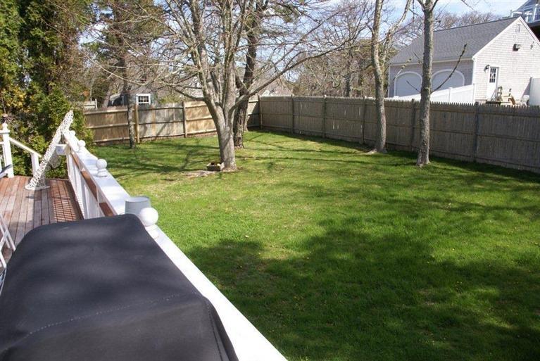 39 Pine Grove Road Chatham, MA 02633 - Photo 33 of 34 a view of a backyard with wooden fence