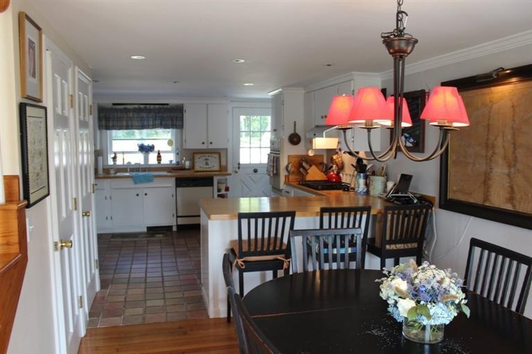 39 Pine Grove Road Chatham, MA 02633 - Photo 10 of 34 a view of a dining room with furniture window and outside view
