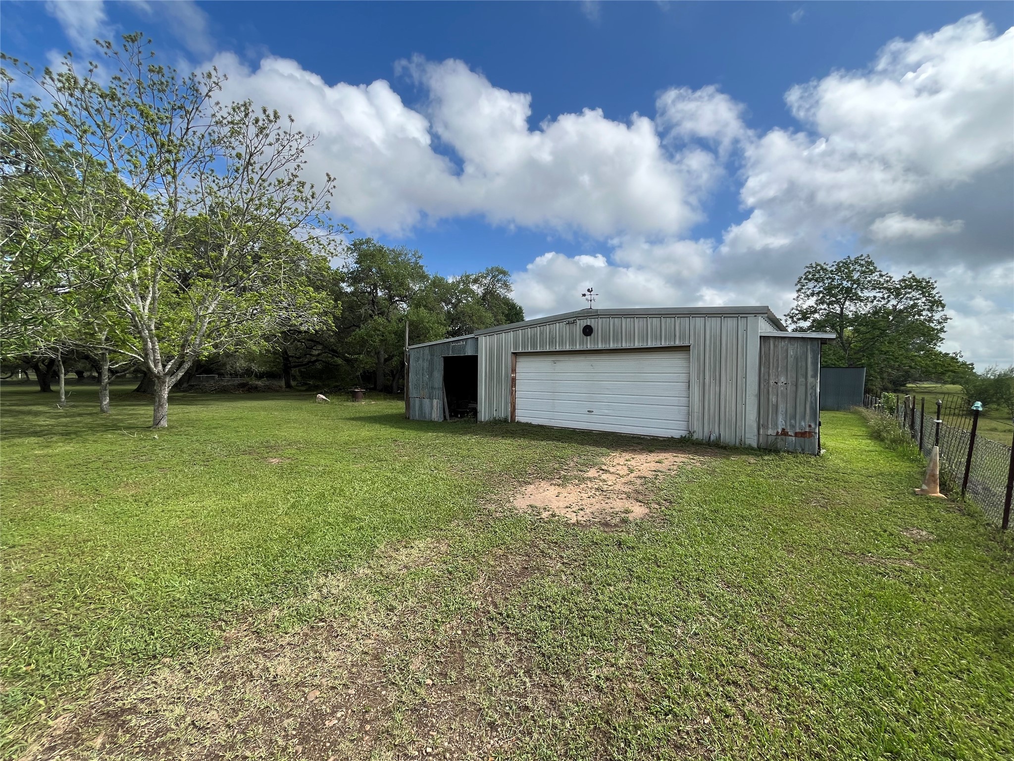 1475 Cr 16 Road Garwood, TX 77442 - Photo 10 of 43 a backyard of a house with lots of green space