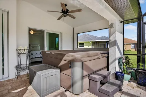 an aerial view of a house with swimming pool patio and outdoor seating