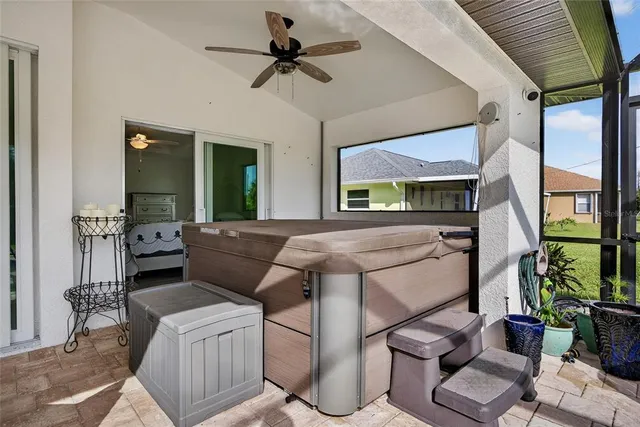 an aerial view of a house with swimming pool patio and outdoor seating