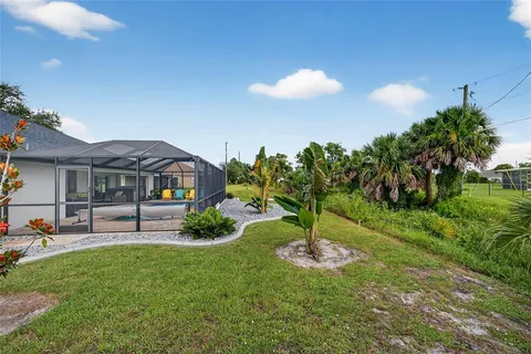 an aerial view of a house with outdoor space swimming pool