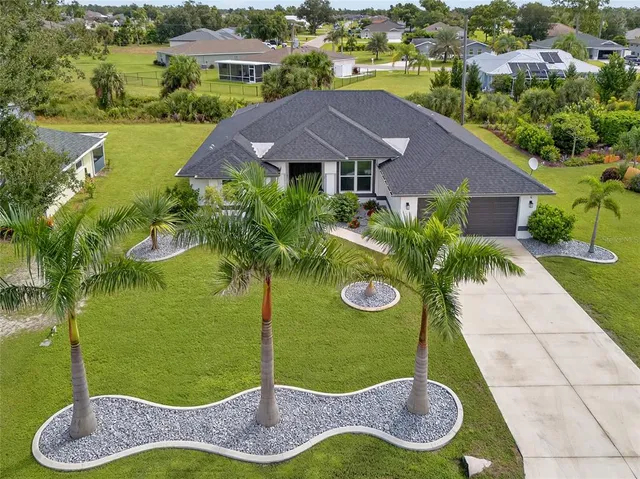 a aerial view of a house with a yard