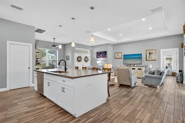 a kitchen with stainless steel appliances a refrigerator stove microwave and cabinets