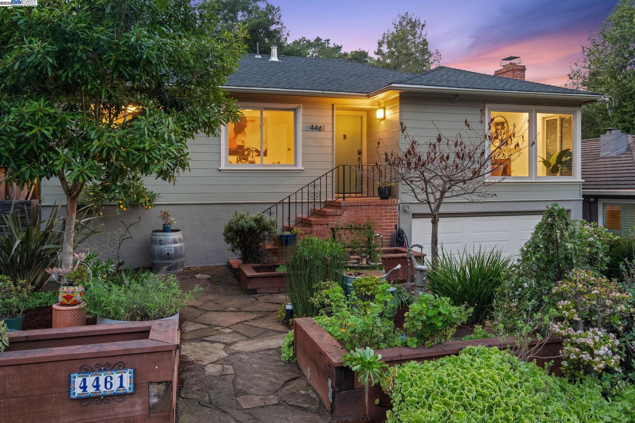 a front view of a house with garden