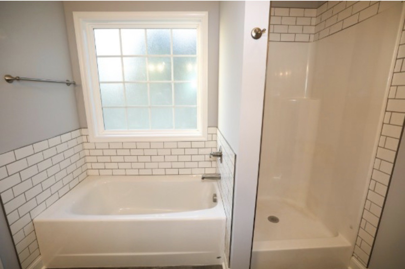 7246 Winding Way Pleasant View, TN 37146 - Photo 13 of 24 a bathroom with a bathtub