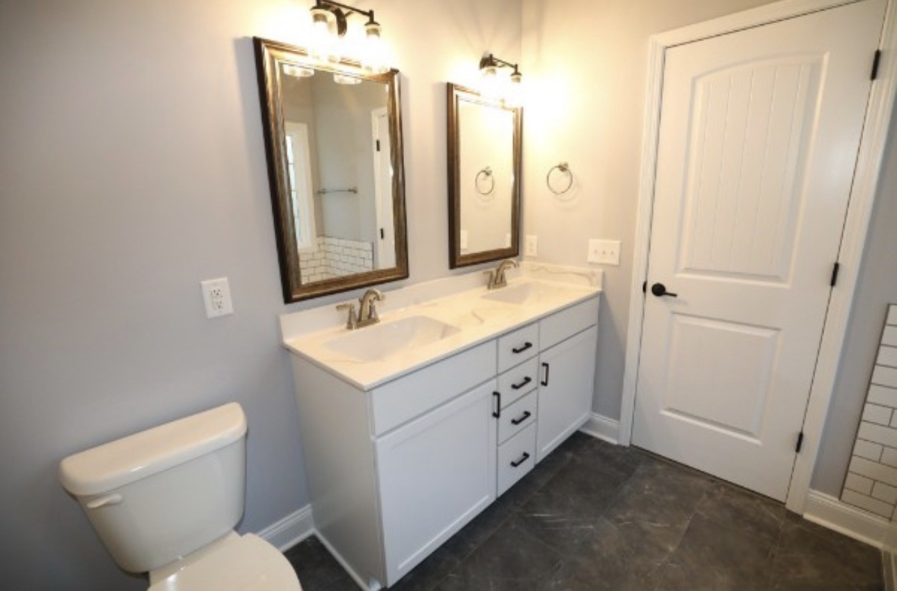 7246 Winding Way Pleasant View, TN 37146 - Photo 14 of 24 a bathroom with a sink mirror vanity and toilet