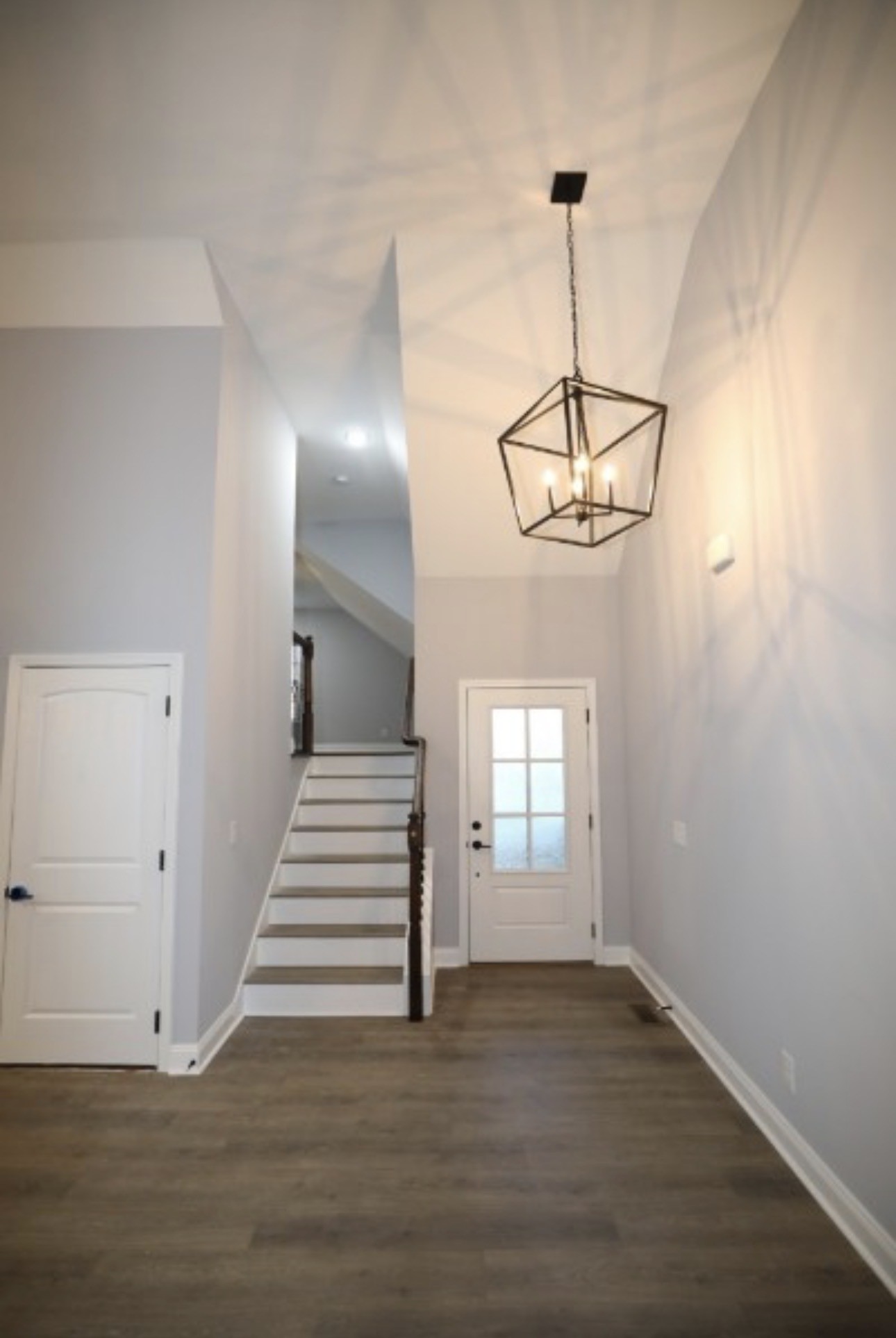7246 Winding Way Pleasant View, TN 37146 - Photo 20 of 24 a view of a room with wooden floor and white walls