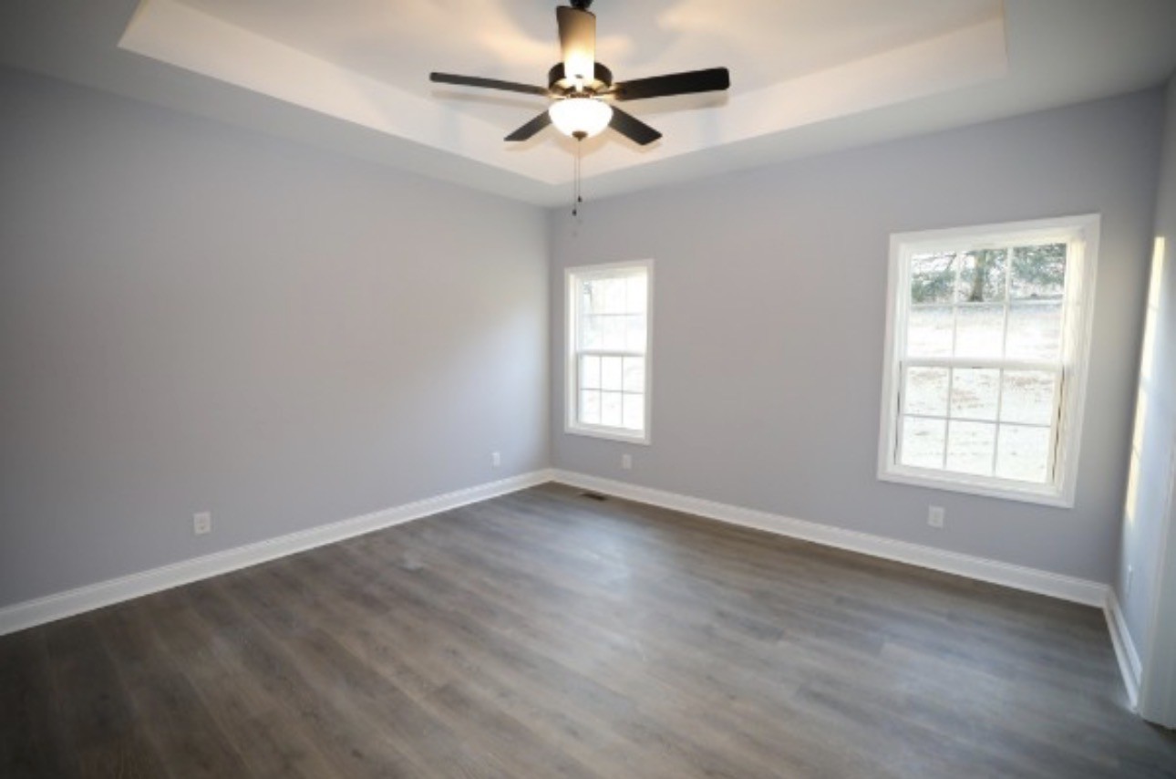 7246 Winding Way Pleasant View, TN 37146 - Photo 9 of 24 wooden floor in an empty room with a window