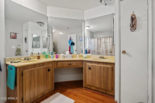 a view of bathroom with dual sinks