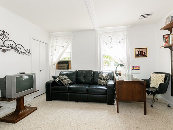 192 Spiers Road Newton, MA 02459 - Photo 13 of 15 a living room with furniture and a flat screen tv