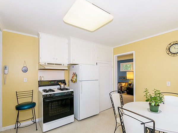192 Spiers Road Newton, MA 02459 - Photo 7 of 15 a kitchen with stainless steel appliances a stove a refrigerator cabinets and a dining table