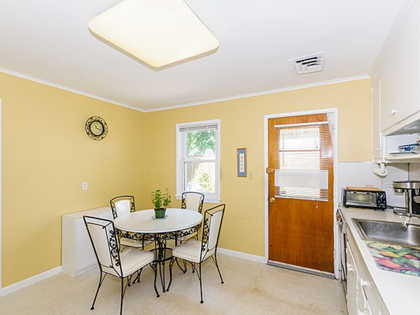 192 Spiers Road Newton, MA 02459 - Photo 8 of 15 a view of a dining room with furniture and a kitchen