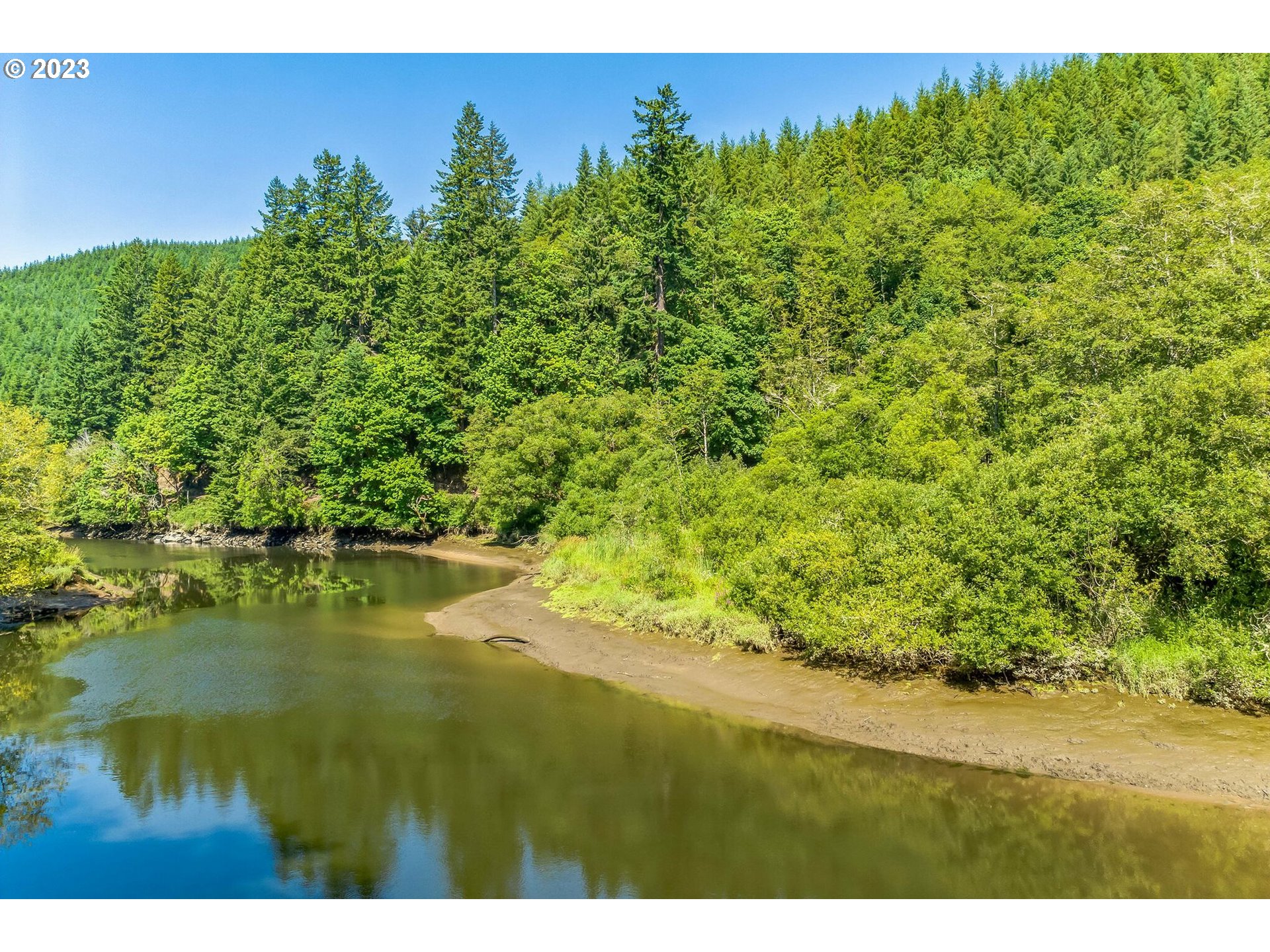 Elk City Road Toledo, OR 97391 - Photo 18 of 34 a view of a lake with a yard