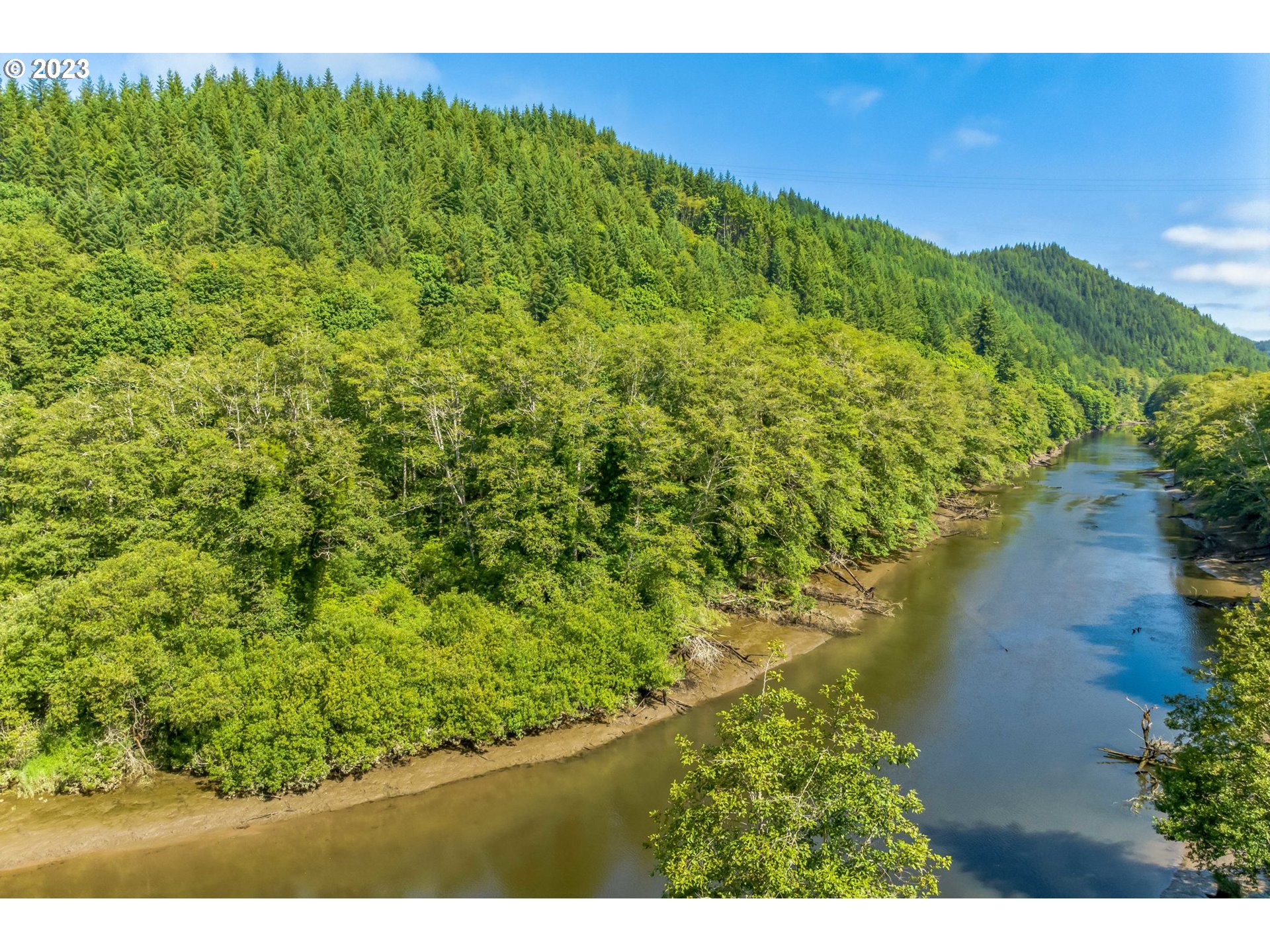 Elk City Road Toledo, OR 97391 - Photo 2 of 34 a view of a green yard with an outdoor seating