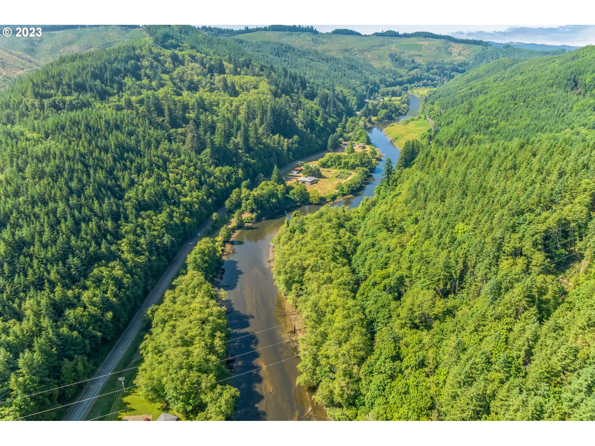 Elk City Road Toledo, OR 97391 - Photo 6 of 34 a view of a lake with a yard