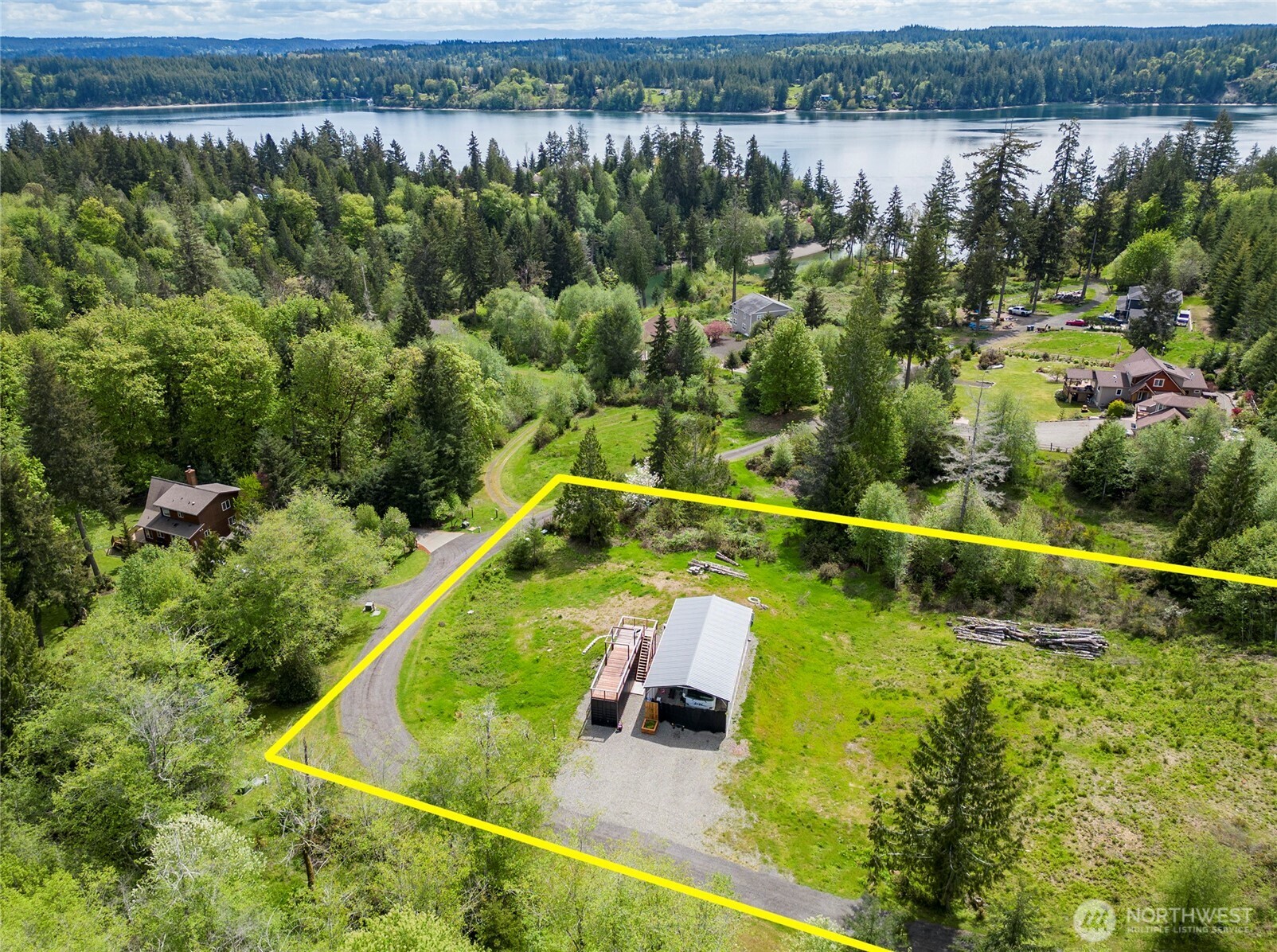 770 East April Avenue Grapeview, WA 98546 - Photo 18 of 21 a view of a swimming pool with a yard