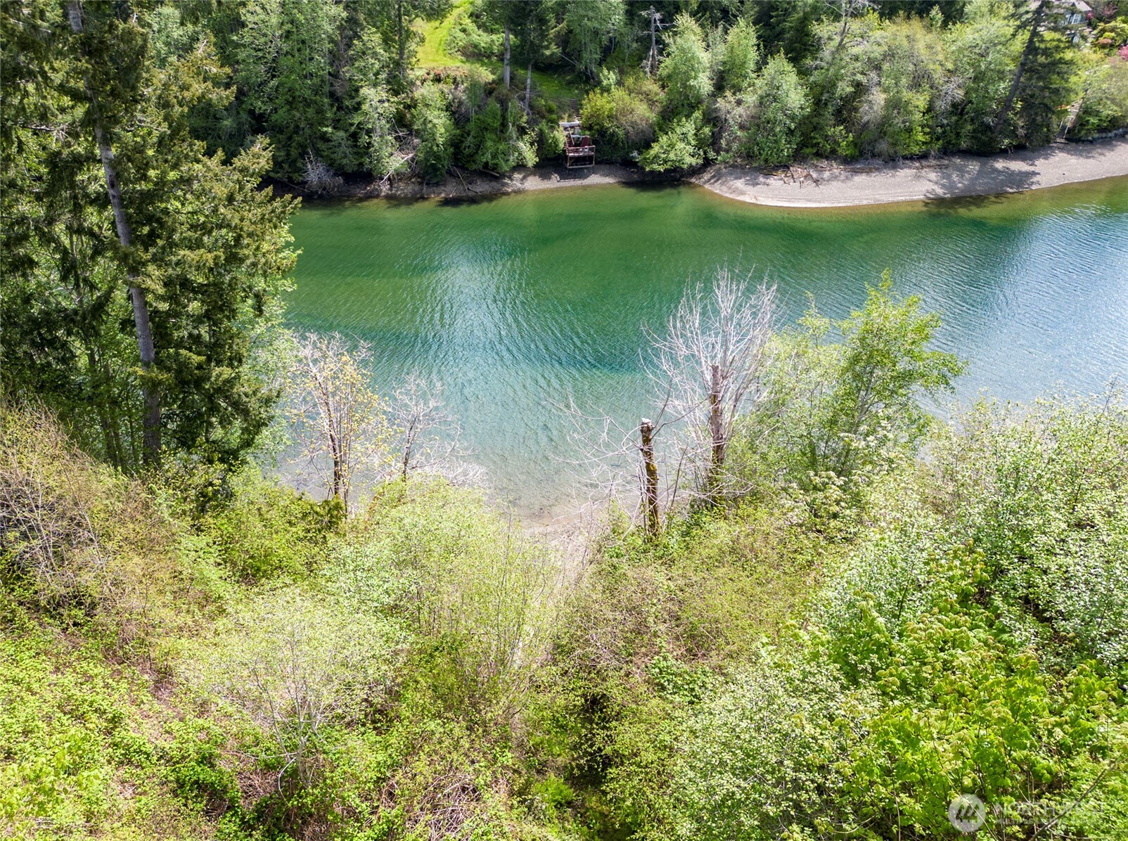 770 East April Avenue Grapeview, WA 98546 - Photo 5 of 21 a view of a lake view with a garden