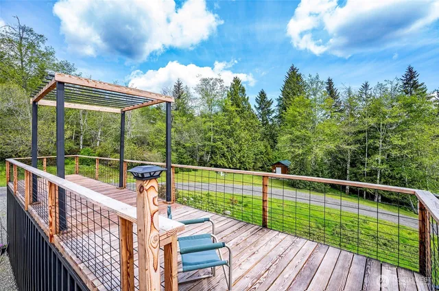 a view of balcony with deck and wooden floor