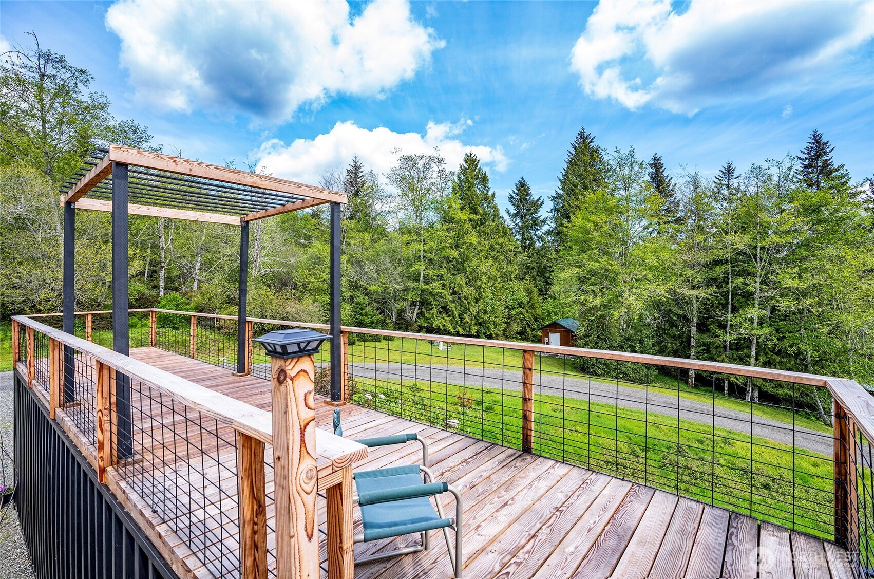 770 East April Avenue Grapeview, WA 98546 - Photo 7 of 21 a view of balcony with deck and wooden floor