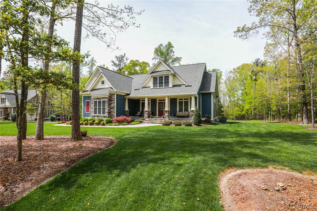11512 Barrows Ridge Lane Chesterfield, VA 23838 - Photo 2 of 45 a front view of a house with a garden