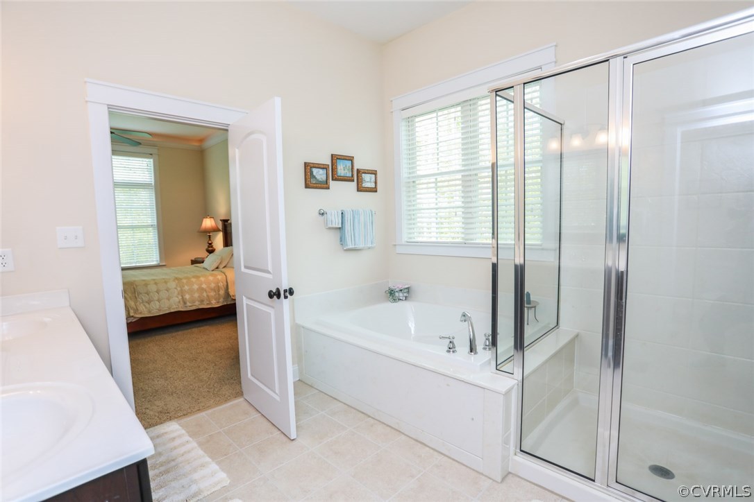 11512 Barrows Ridge Lane Chesterfield, VA 23838 - Photo 27 of 45 a en suite spacious bathroom with a tub shower and a sink