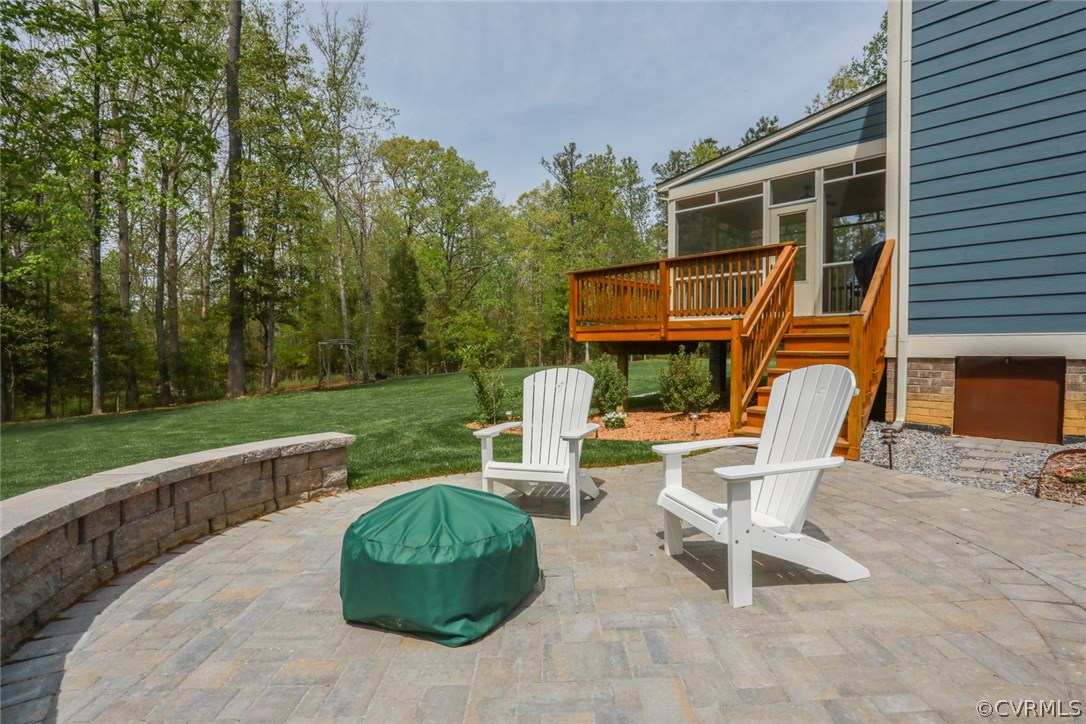11512 Barrows Ridge Lane Chesterfield, VA 23838 - Photo 41 of 45 a view of a chair and table in backyard of the house