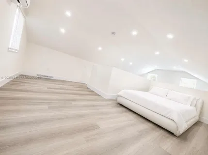a living room with furniture and a night stand