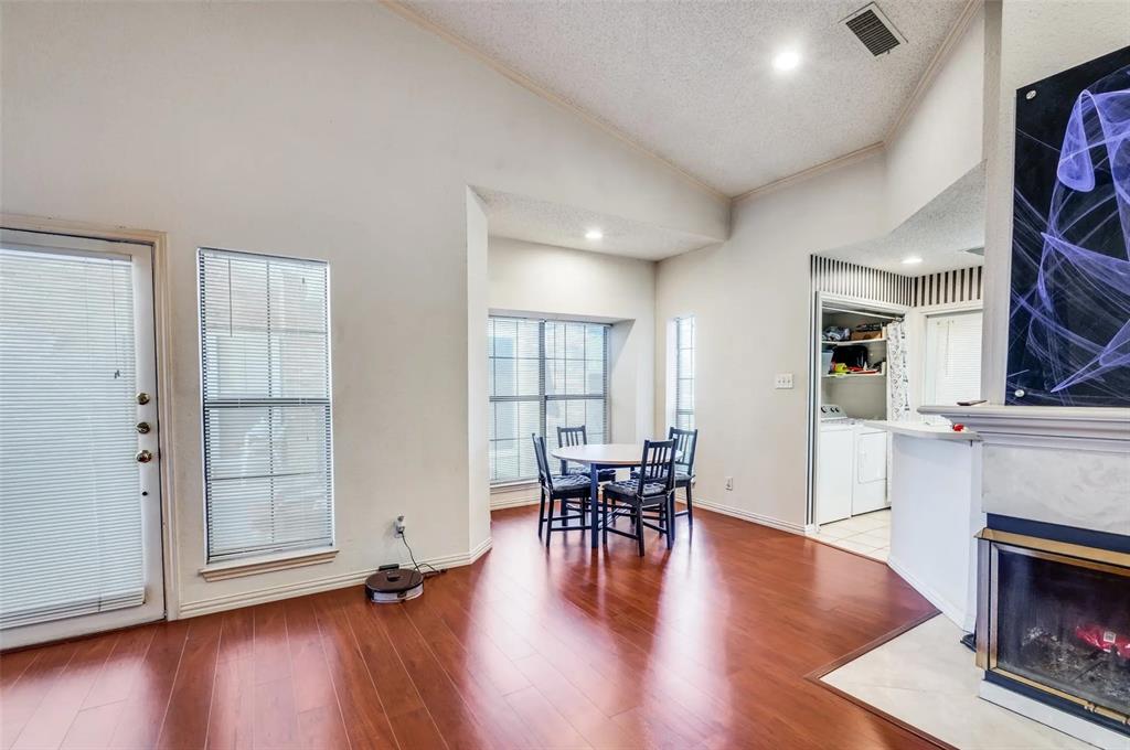 401 Pebble Way, Unit 237 Arlington, TX 76006 - Photo 3 of 12 a view of a livingroom with furniture wooden floor and windows