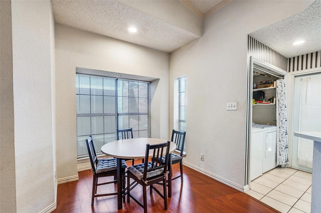 401 Pebble Way, Unit 237 Arlington, TX 76006 - Photo 4 of 12 a view of a dining room with furniture and wooden floor
