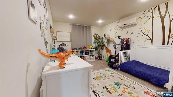 a bed room with a bed and a chair