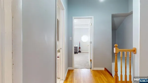 a view of a bedroom from a corridor
