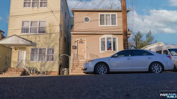 a car parked in front of a house