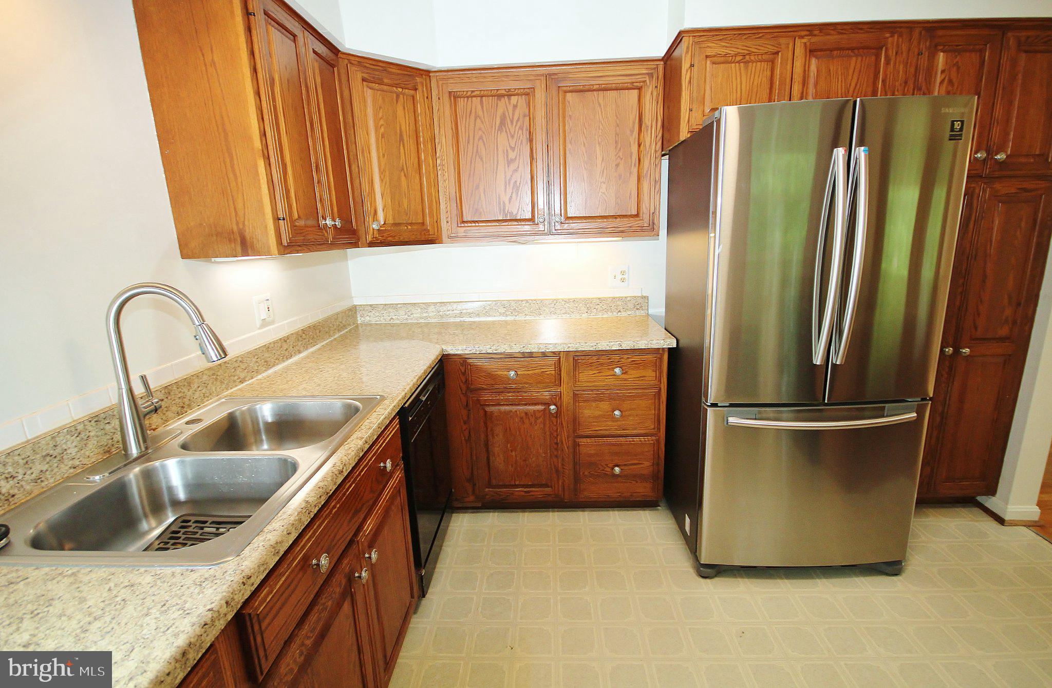5504 Inverchapel Road Springfield, VA 22151 - Photo 9 of 51 Modern kitchen with rich wood accents.