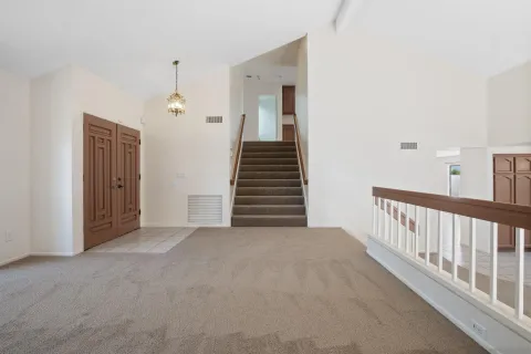 a view of a hallway with closet and entryway