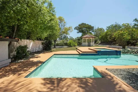 a view of a house with swimming pool