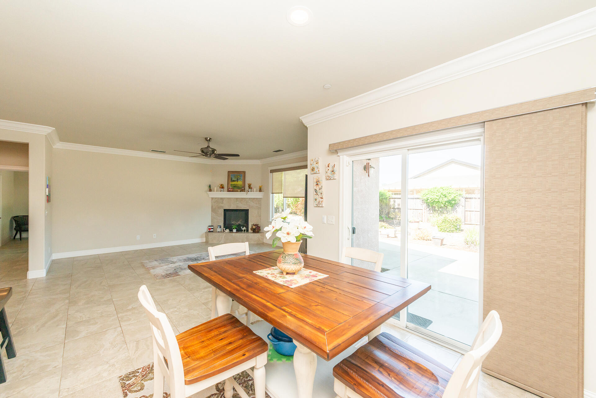3326 Hotlam Road Redding, CA 96002 - Photo 17 of 60 a living room with a table and a large window