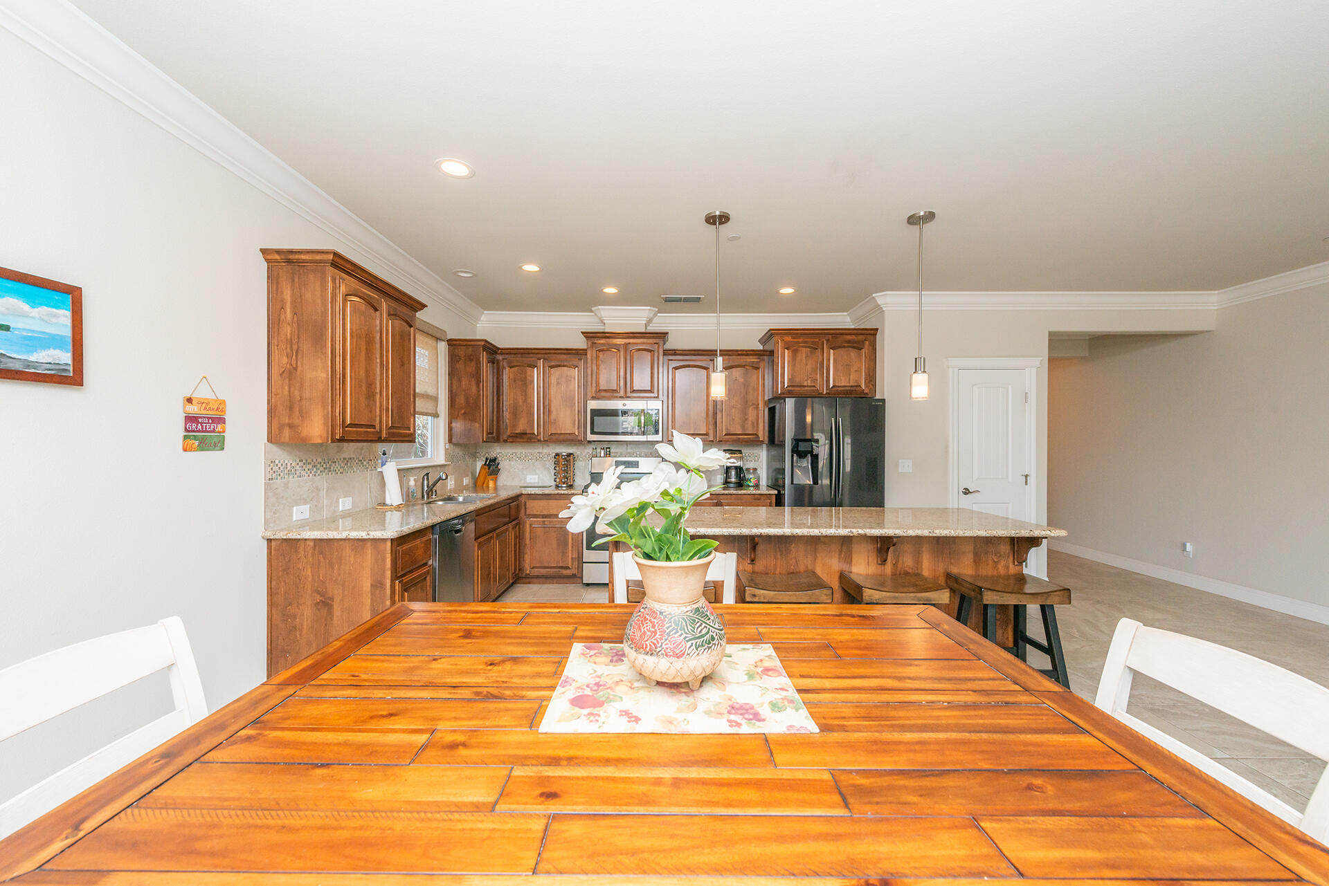3326 Hotlam Road Redding, CA 96002 - Photo 21 of 60 a view of a kitchen with kitchen island stainless steel appliances a sink and counter