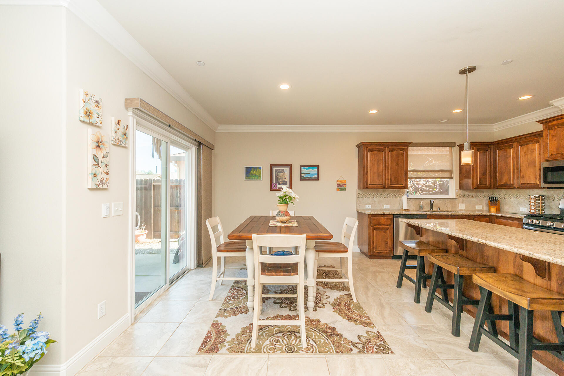 3326 Hotlam Road Redding, CA 96002 - Photo 22 of 60 a very nice looking dining room with a large window and white kitchen