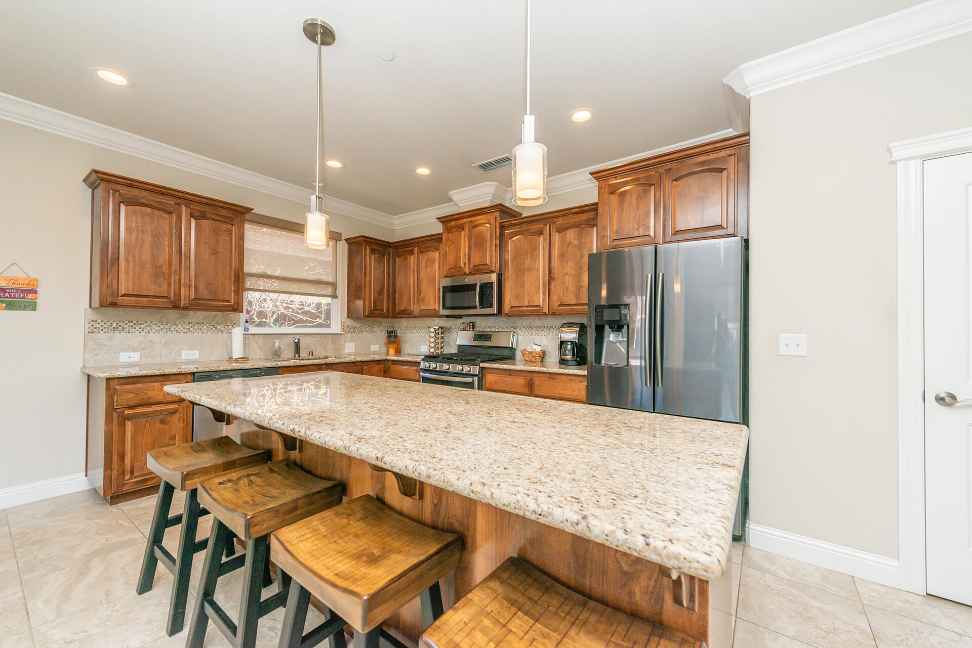 3326 Hotlam Road Redding, CA 96002 - Photo 24 of 60 a kitchen with stainless steel appliances granite countertop a sink refrigerator and cabinets