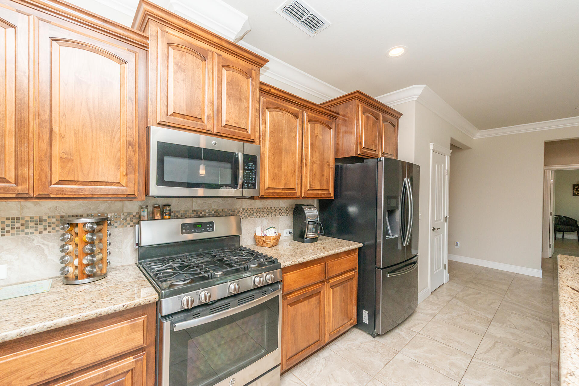 3326 Hotlam Road Redding, CA 96002 - Photo 26 of 60 a kitchen with stainless steel appliances granite countertop a refrigerator stove and sink