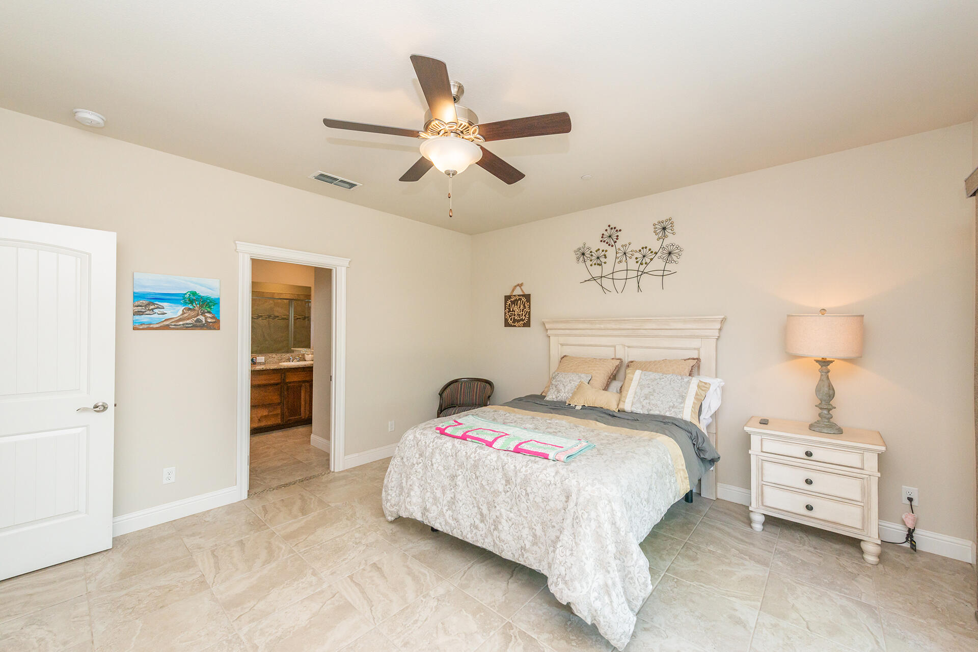 3326 Hotlam Road Redding, CA 96002 - Photo 31 of 60 a bedroom with a bed and a ceiling fan
