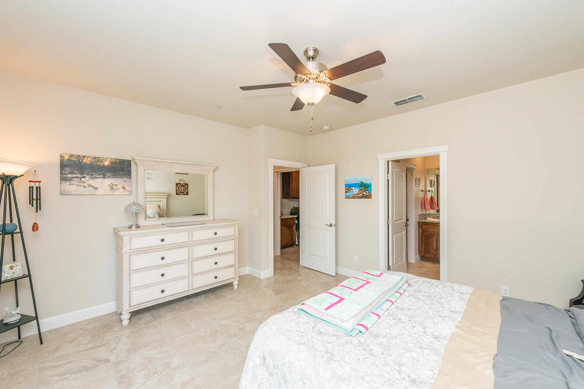 3326 Hotlam Road Redding, CA 96002 - Photo 32 of 60 a bedroom with a bed and a chandelier