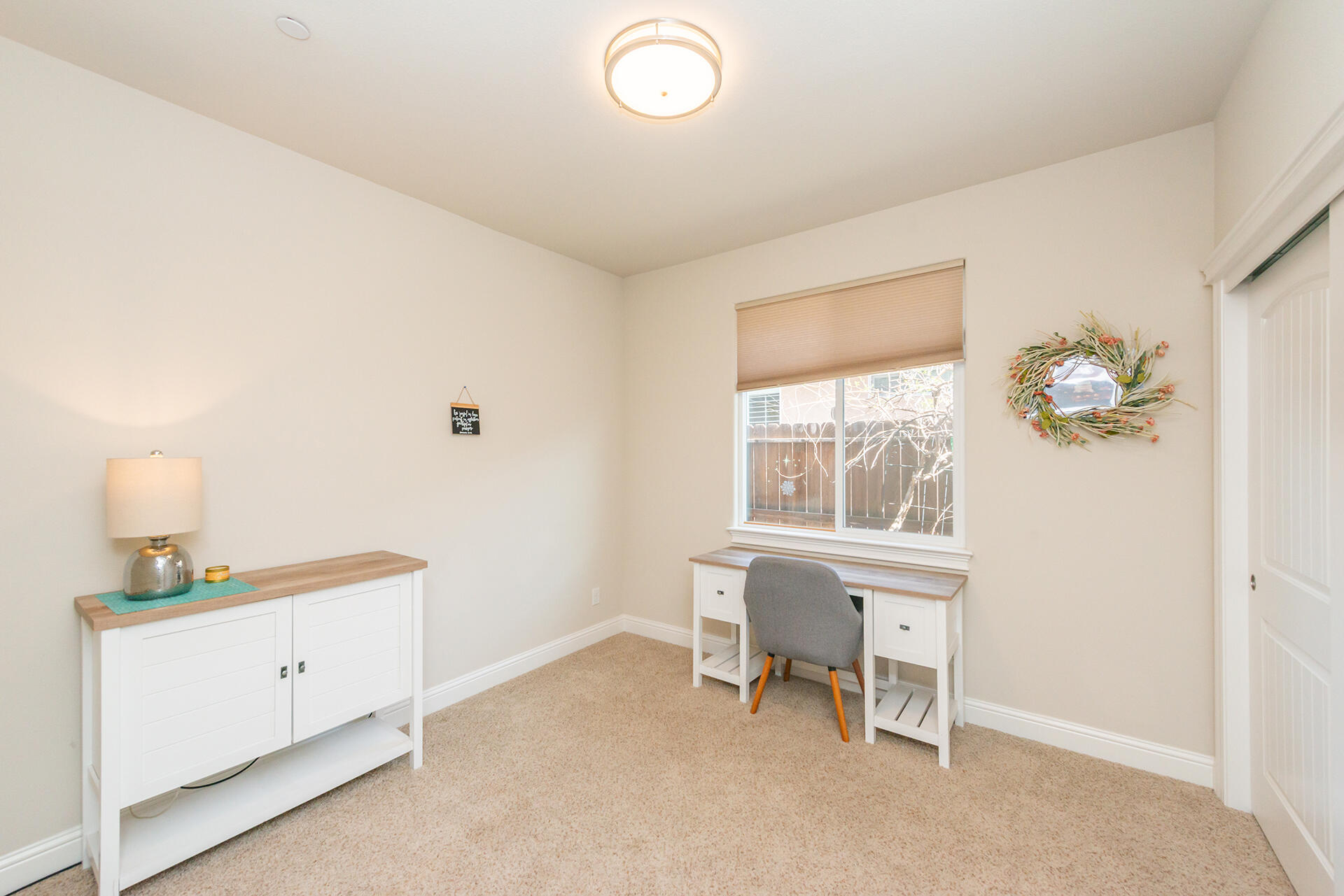 3326 Hotlam Road Redding, CA 96002 - Photo 38 of 60 a view of a workspace with furniture and a window