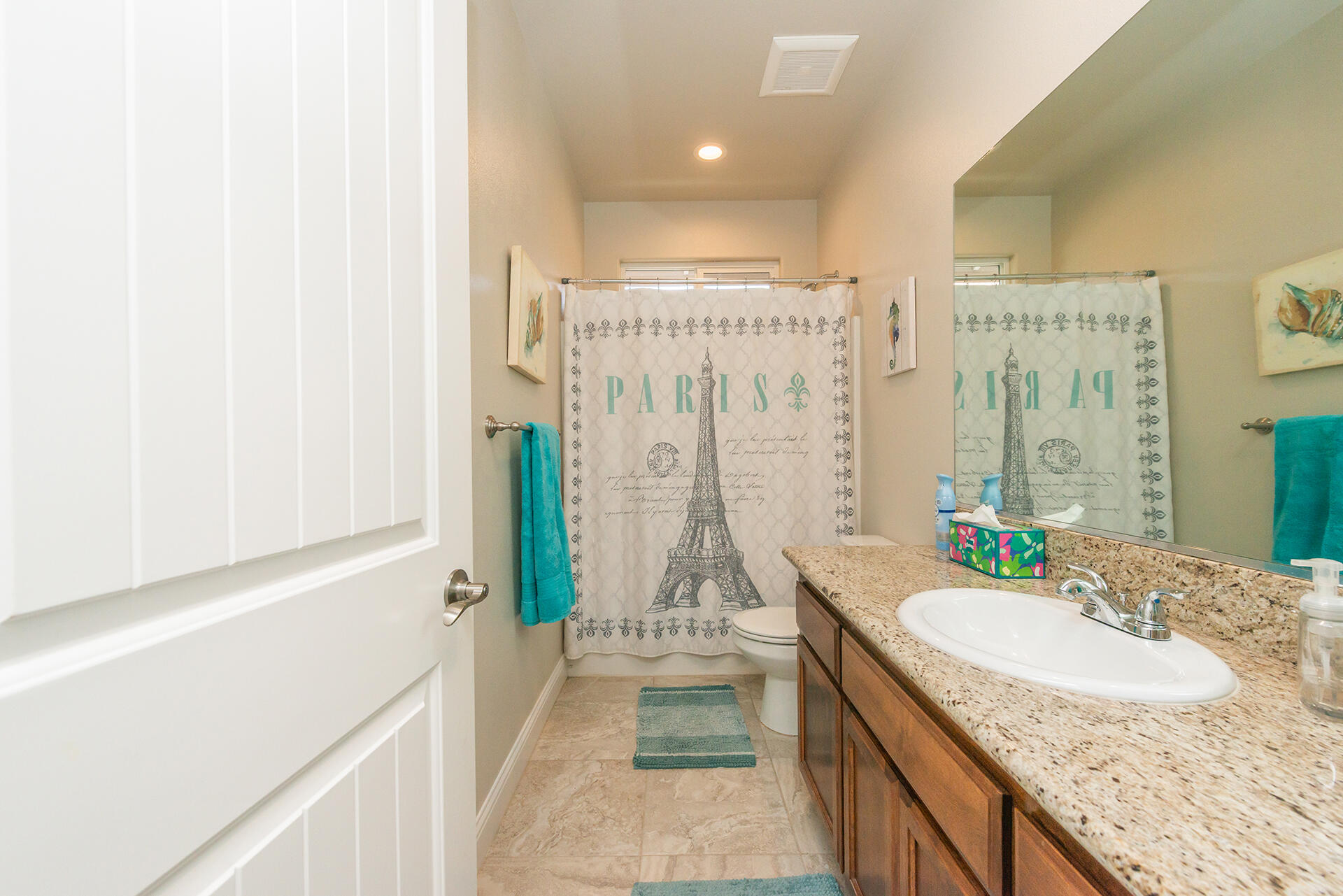 3326 Hotlam Road Redding, CA 96002 - Photo 41 of 60 a bathroom with a granite countertop sink a toilet and shower