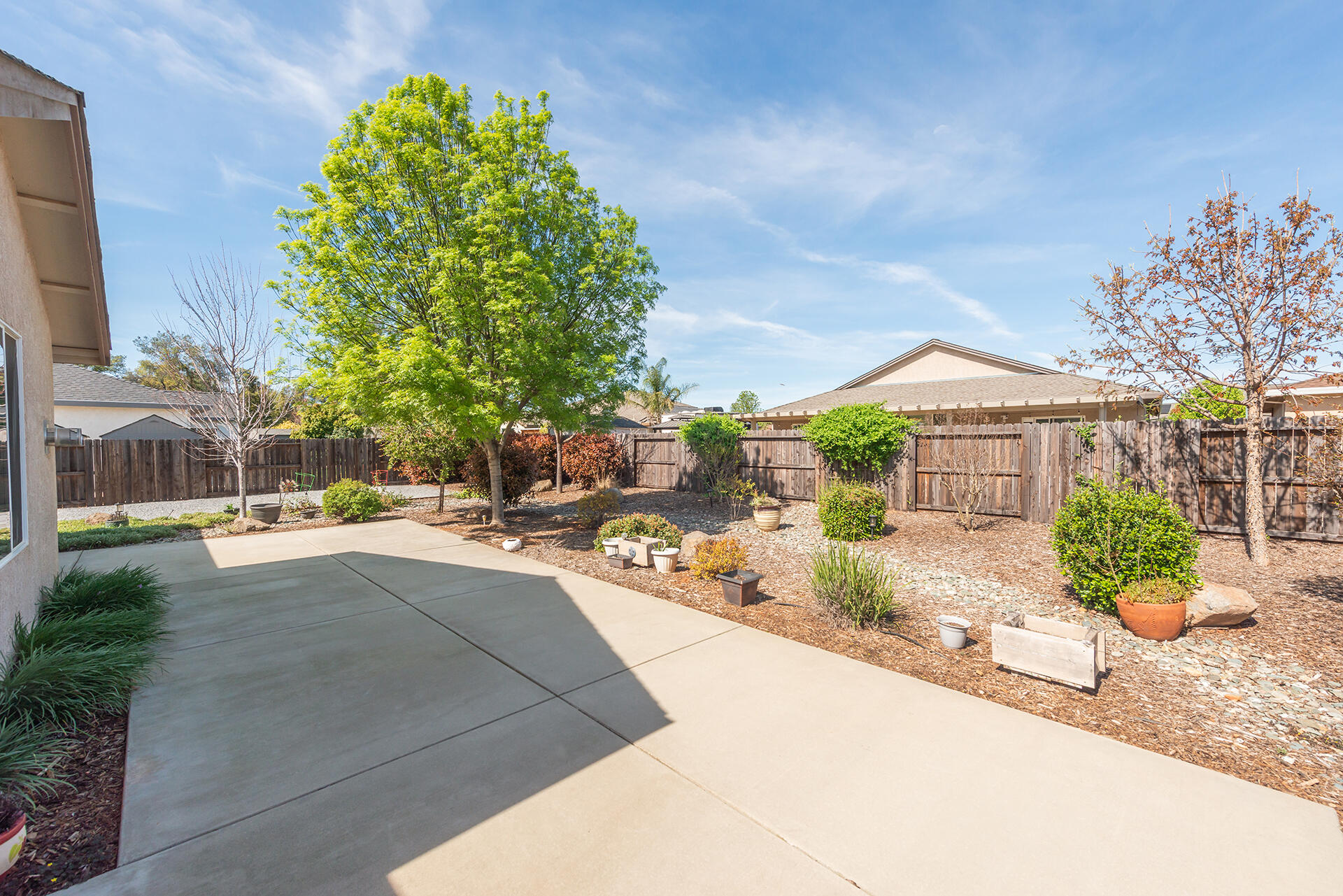 3326 Hotlam Road Redding, CA 96002 - Photo 44 of 60 a view of a house with a yard and sitting area