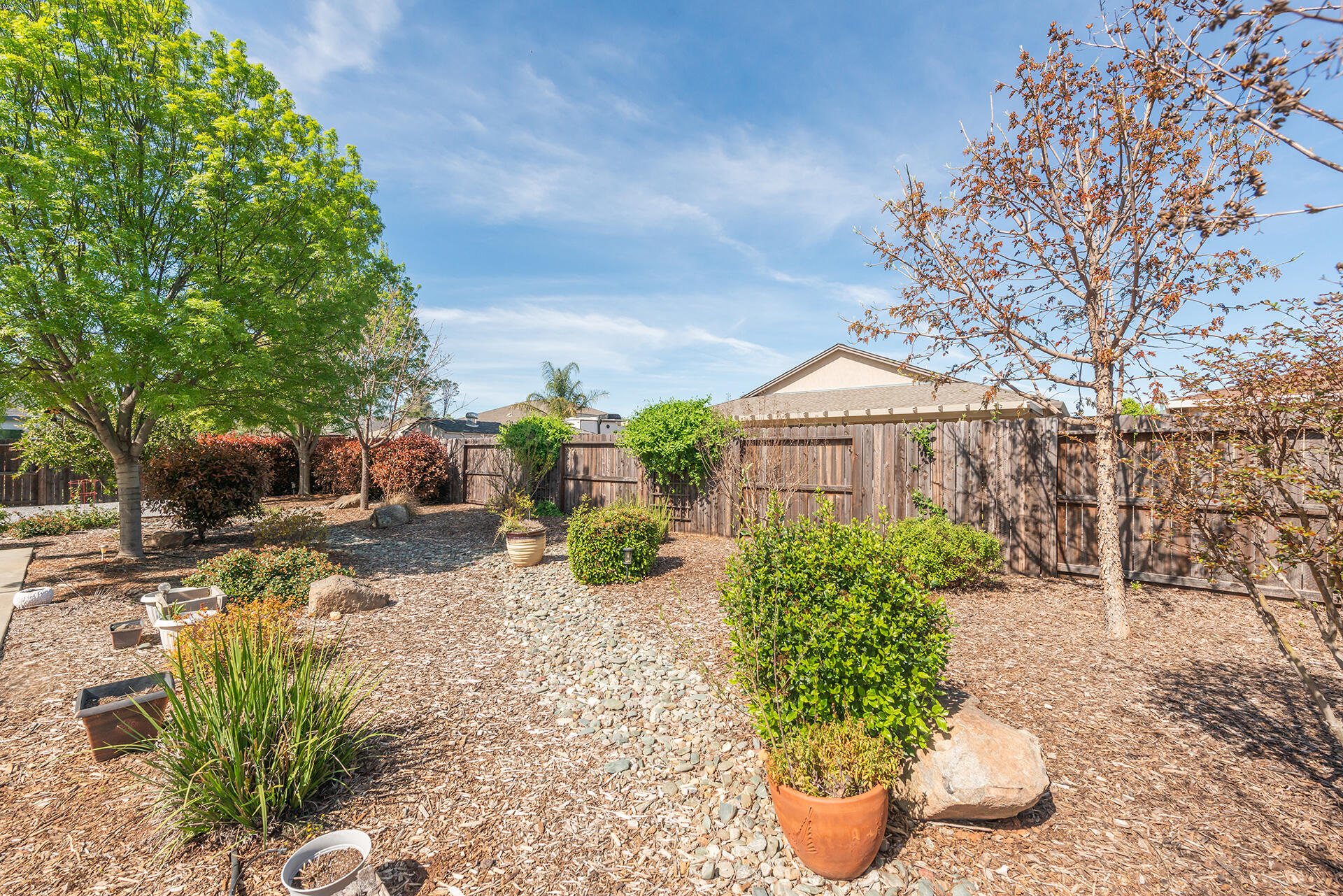 3326 Hotlam Road Redding, CA 96002 - Photo 51 of 60 a view of a backyard with sitting area