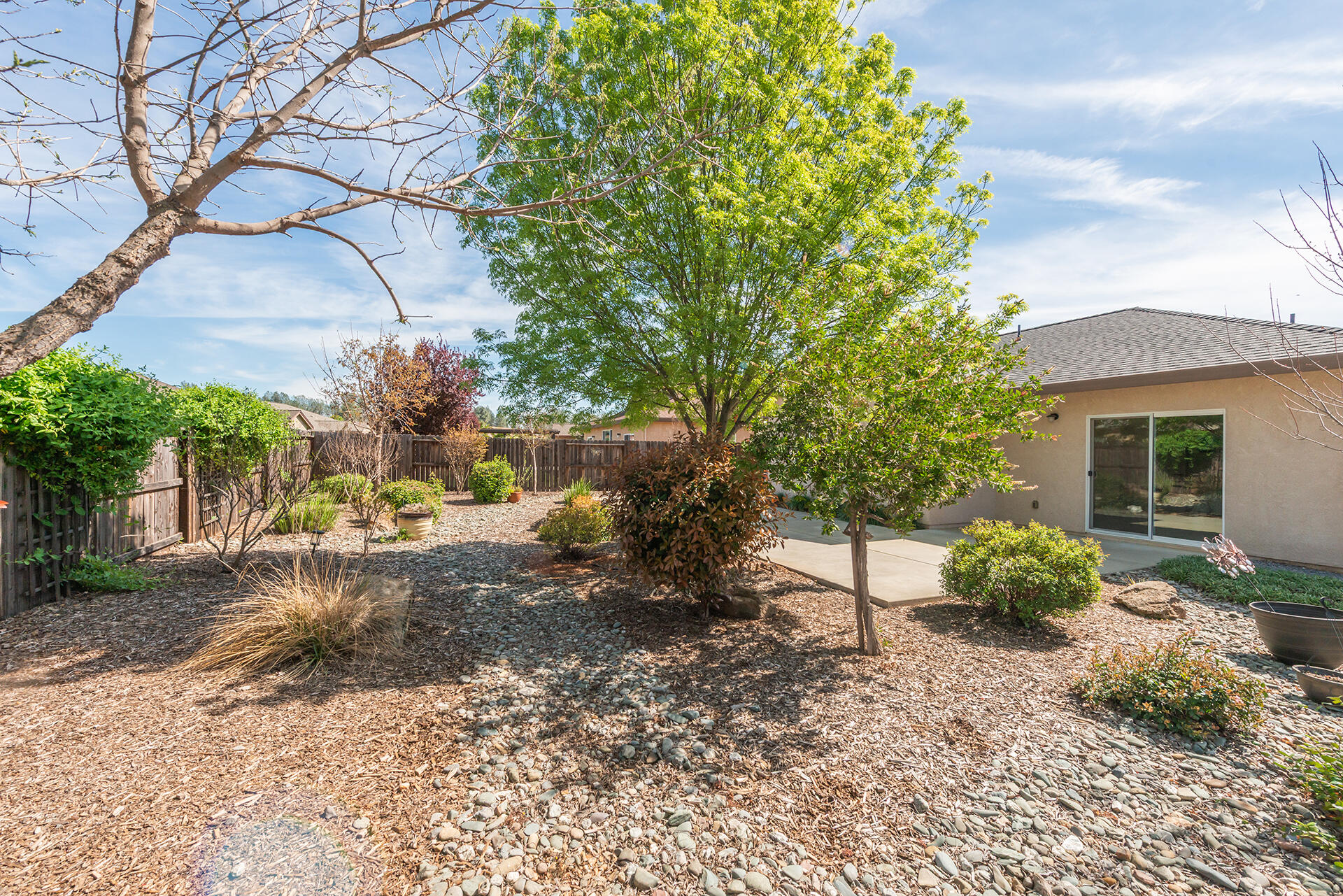3326 Hotlam Road Redding, CA 96002 - Photo 52 of 60 a view of a backyard with sitting area