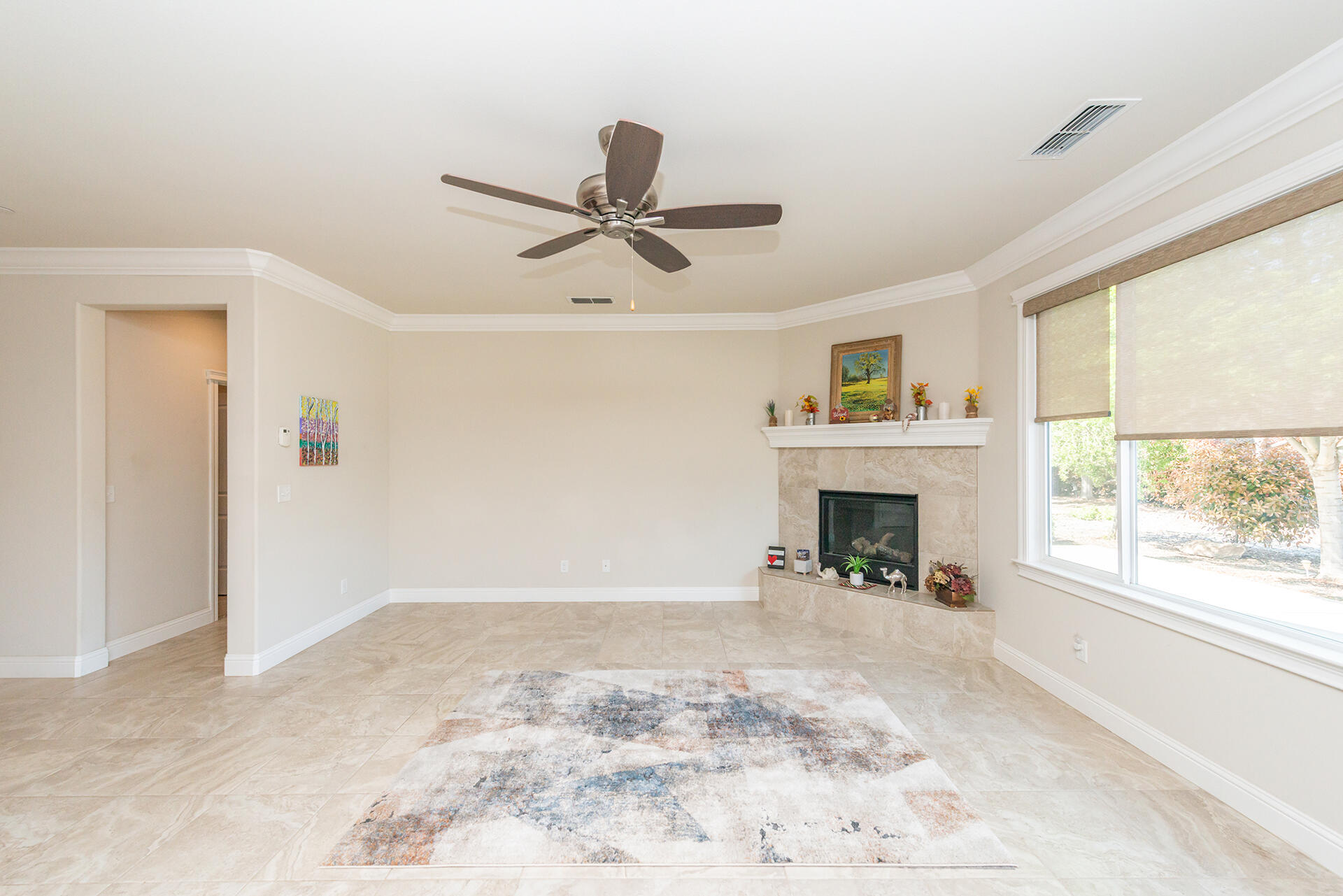 3326 Hotlam Road Redding, CA 96002 - Photo 9 of 60 a view of a livingroom with a fireplace and window